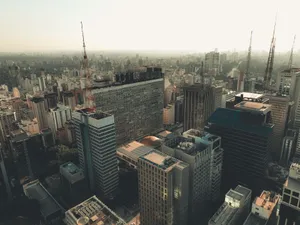 Aerial shot of São Paulo skyline featuring modern skyscrapers and clear skies. jigsaw puzzle