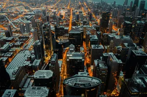 Stunning aerial view of Chicago's illuminated skyline dusted with snow at twilight. jigsaw puzzle