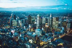 A breathtaking aerial view of Melbourne's illuminated skyline with modern skyscrapers at night. jigsaw puzzle