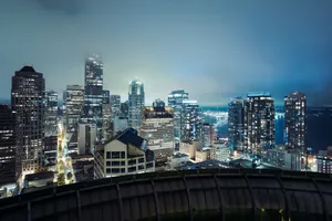 Seattle skyline view with skyscrapers illuminated at night, captured from a rooftop. jigsaw puzzle
