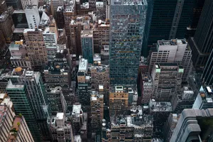 Aerial shot of New York City's dense downtown skyscrapers, capturing the urban hustle and dynamic architecture. jigsaw puzzle