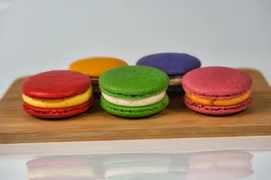 A vibrant assortment of macarons on a wooden board, highlighting rich colors and delicious textures. jigsaw puzzle