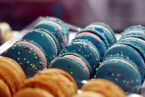Vibrant blue and pink macarons with colorful sprinkles creating a visually appealing treat. jigsaw puzzle