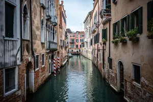 Idyllic view of Venice's canal with historic buildings lining the waterway. jigsaw puzzle