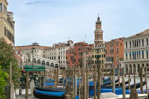 Picturesque view of gondolas on the Grand Canal in Venice, featuring the historic Rialto Bridge. jigsaw puzzle