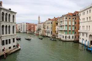 Charming view of Venice canal with gondolas and historic buildings, a must-visit tourist attraction. jigsaw puzzle