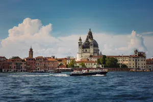 Beautiful canal view with boats and Santa Maria della Salute in Venice. jigsaw puzzle