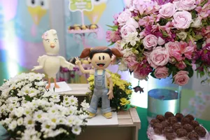 Whimsical toys and vibrant floral arrangement on display at a decorative exhibition. jigsaw puzzle