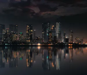 Captivating night view of Mumbai skyline with skyscrapers and reflections on still water. jigsaw puzzle