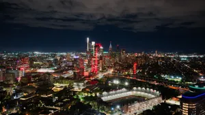 A breathtaking aerial view of Philadelphia's illuminated skyline at night, highlighting the vibrant cityscape and a prominent stadium. jigsaw puzzle