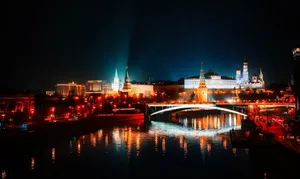Stunning night view of Moscow's illuminated skyline with reflections on the river. jigsaw puzzle