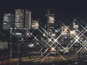 Dazzling view of Nagoya's skyline at night, showcasing illuminated skyscrapers and railway tracks. jigsaw puzzle