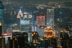 A dazzling view of Taipei's illuminated skyscrapers showcasing the city's modern architecture at night. jigsaw puzzle