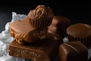 A delectable assortment of chocolate desserts including fudge and peanut clusters. jigsaw puzzle