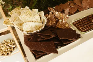 Indulge in a gourmet display of assorted chocolates and nut-topped treats. jigsaw puzzle