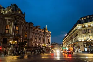 Paris night scene featuring the Opéra Garnier, vibrant city life, and illuminated streets. jigsaw puzzle