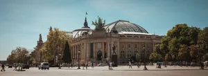 A captivating view of the Grand Palais in Paris, showcasing its iconic architecture under a clear blue sky. jigsaw puzzle