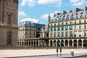 A classic Parisian street view featuring ornate buildings and a clear sky. jigsaw puzzle