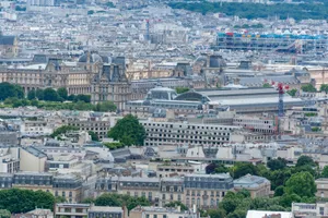 Aerial view of Paris showcasing the Louvre Museum and iconic cityscape in a summer setting. jigsaw puzzle