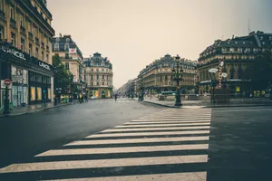 Charming urban scene in an old town with historic buildings and crosswalk in the foreground. jigsaw puzzle
