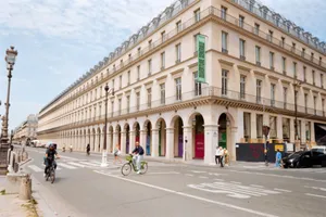 Charming Paris street scene with cyclists and pedestrians by classic architecture. jigsaw puzzle