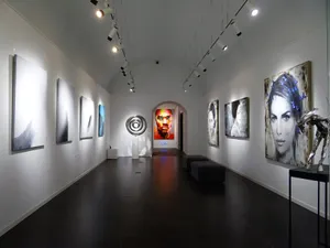 Sleek and modern art gallery with various contemporary paintings on display. jigsaw puzzle