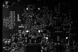Detailed black and white photo of a circuit board showing intricate components, perfect for tech projects. jigsaw puzzle