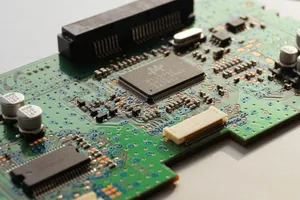 Detailed close-up photo of a circuit board highlighting microchip components and electronic circuits. jigsaw puzzle
