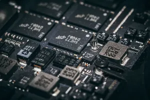 Detailed close-up of electronic microchips on a circuit board, showcasing technology and engineering intricacies. jigsaw puzzle