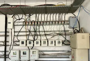 Complex network of electrical wiring and control panels in an industrial setting. jigsaw puzzle