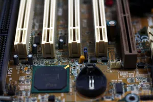 Detailed close-up of computer motherboard showing components like RAM slots and capacitors. jigsaw puzzle