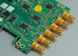 Detailed view of a green circuit board featuring multiple connectors and intricate components. jigsaw puzzle