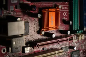 Detailed view of a computer motherboard showcasing intricate electronic components. jigsaw puzzle