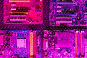 A vibrant image showcasing various circuit boards through a wire mesh, highlighting electronics and technology. jigsaw puzzle