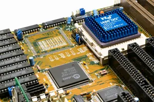 Detailed view of an Intel i486 DX2 CPU installed on a vintage motherboard with chips and circuits. jigsaw puzzle