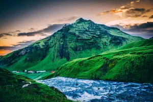 Experience the serene beauty of Iceland's mountains and rivers at sunset, offering a stunning natural landscape. jigsaw puzzle