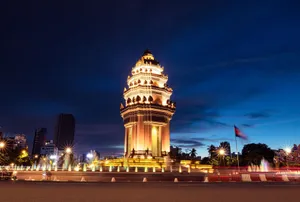 A vibrant night view of the illuminated Independence Monument in Phnom Penh, Cambodia. jigsaw puzzle