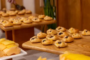 Close-up of beautifully arranged artisan pastries on wooden platters in a cozy setting. jigsaw puzzle