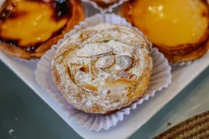 A tempting assortment of freshly baked Brazilian pastries, including almond pastries on a tray. jigsaw puzzle