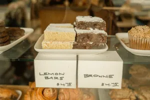 Delicious display of lemon bars and brownies in a bakery with price tags. jigsaw puzzle