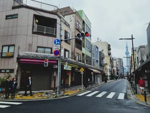 Street scene in Tokyo with pedestrians and the iconic Tokyo Skytree visible in the distance. jigsaw puzzle