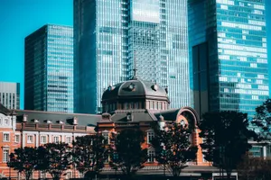 Urban scene of modern skyscrapers and historic Tokyo Station in vibrant morning light. jigsaw puzzle