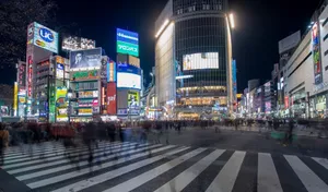 Experience the vibrant energy of Shibuya Crossing in Tokyo at night, with bustling crowds and colorful neon lights. jigsaw puzzle