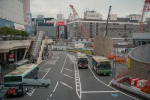 Street view in Tokyo with buses, cranes, and modern buildings. Urban life in Japan. jigsaw puzzle