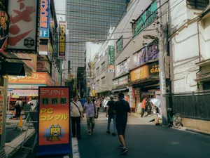 A vibrant street scene in Akihabara, Tokyo, showcasing modern architecture and lively crowd. jigsaw puzzle