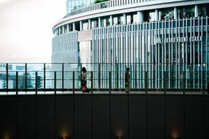 People walking near Grand Front Osaka with a focus on modern architecture and urban design. jigsaw puzzle