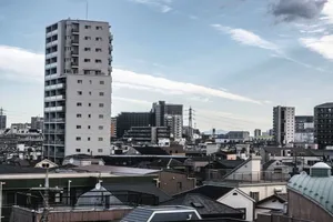 View of Tokyo's urban skyline with high-rise buildings under a clear sky. jigsaw puzzle