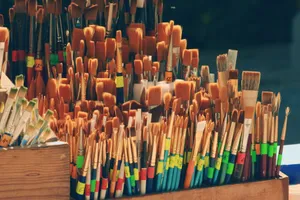 Collection of paintbrushes in a wooden holder, perfect for art projects. jigsaw puzzle