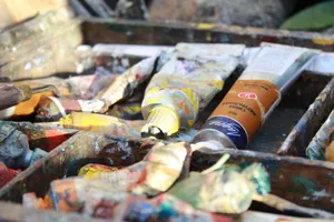 A close-up view of colorful paint tubes in an artist's box, perfect for creative projects. jigsaw puzzle
