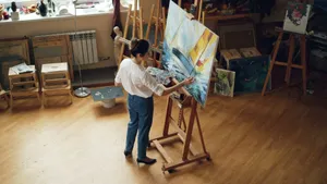 A female artist working on a seascape painting in her art studio. jigsaw puzzle